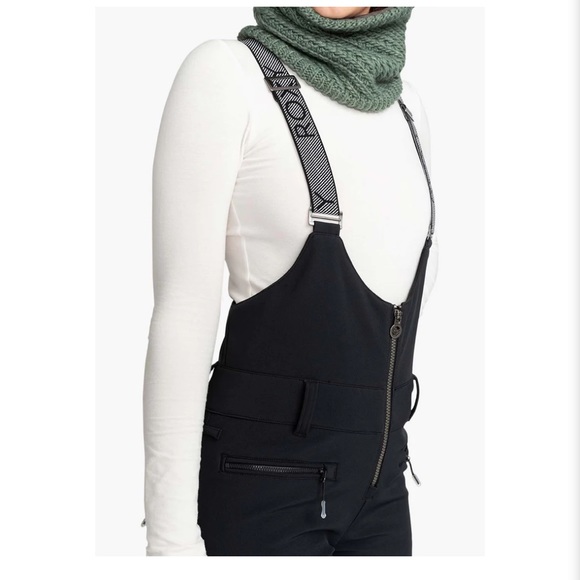 Roxy Women's Summit Bib Pants in pink. - Picture 7 of 9